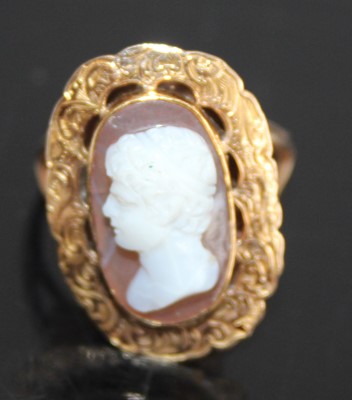 Lot 2439 - A yellow metal carved shell cameo set ring,...
