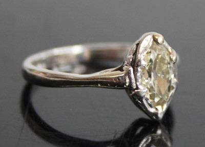 Lot 2433 - A platinum and diamond single stone ring, the...