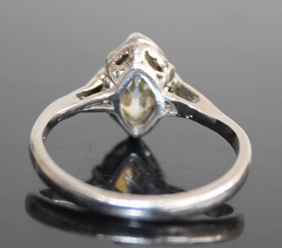 Lot 2433 - A platinum and diamond single stone ring, the...