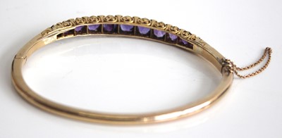Lot 2450 - A yellow metal, amethyst and diamond point set...