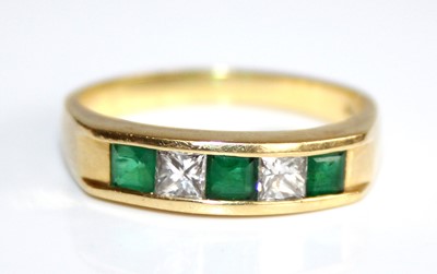 Lot 2467 - An 18ct gold, emerald and diamond set half...