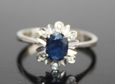 Lot 2470 - A white metal, sapphire and diamond flower...