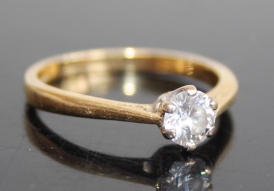 Lot 2789 - An 18ct gold diamond solitaire ring, the claw...