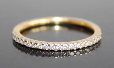 Lot 2818 - A modern 18ct gold diamond half eternity ring,...