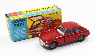 Lot 1430 - Corgi Toys No. 327 M.G.B GT in red with wire...