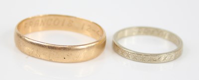 Lot 2473 - A yellow metal wedding band, inscribed to the...