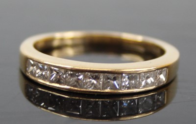 Lot 2461 - An 18ct gold diamond half eternity ring,...