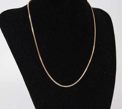 Lot 2478 - A modern 18ct gold flat curb link neck chain 4....