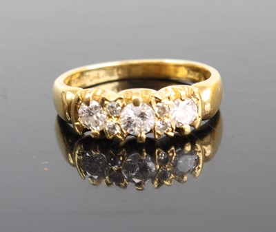Lot 2487 - An 18ct gold diamond half hoop ring, arranged...