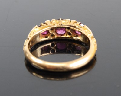 Lot 2488 - An Edwardian ruby & diamond half hoop ring,...