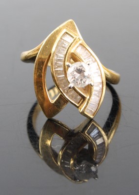 Lot 2814 - A modern 18ct gold diamond dress ring arranged...