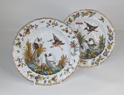 Lot 1 - A pair of continental porcelain plates, relief...