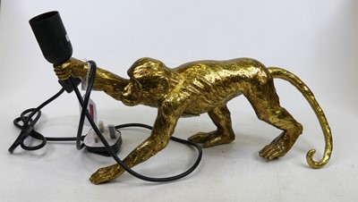 Lot 23 - A modern gilt composite table lamp in the form...