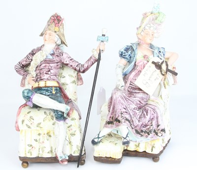 Lot 25 - A pair of continental pottery figures, each...