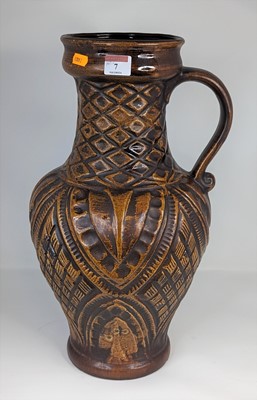 Lot 7 - A West German brown glazed pottery jug, having...
