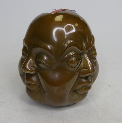Lot 74 - A brass four faced buddha head, height 11.5cm