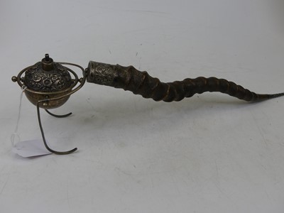 Lot 62 - An Indian white metal oil lamp of spherical...