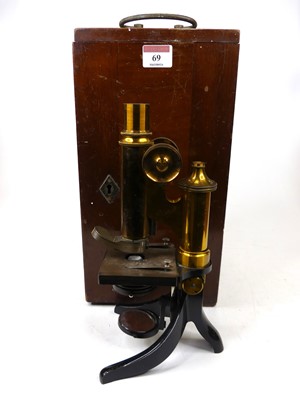Lot 69 - A lacquered brass monocular microscope having...