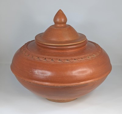 Lot 127 - A burnished earthenware jar, of squat globular...