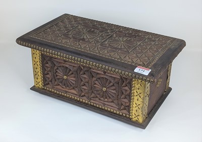 Lot 134 - An eastern carved hardwood and brass mounted...