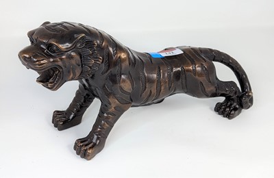 Lot 142 - A bronzed metal model of a tiger, length 31cm