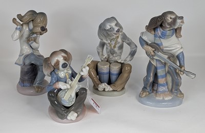 Lot 175 - A Lladro porcelain four-piece dog band,...