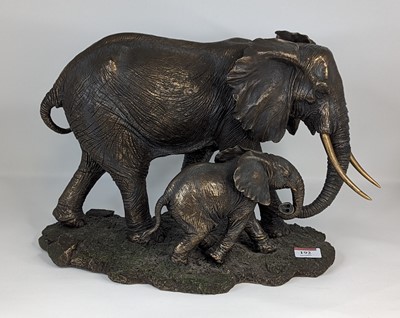 Lot 192 - A bronzed resin elephant group, height 28cm