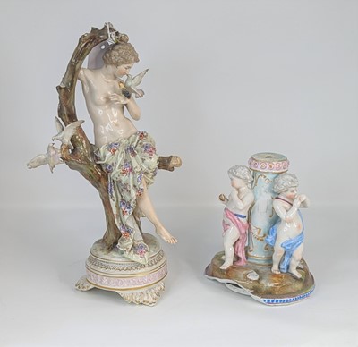 Lot 190 - A continental porcelain figure of a lady shown...