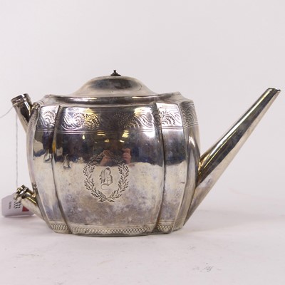 Lot 333 - A George III Scottish silver teapot, of shaped...