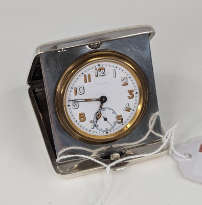 Lot 334 - A George V silver cased travel clock, having a...