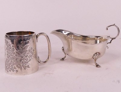 Lot 300 - An Edwardian silver christening mug, decorated...