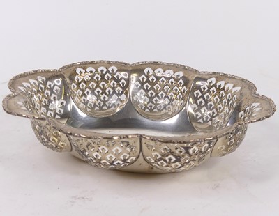 Lot 307 - A George V pierced silver table basket, of...