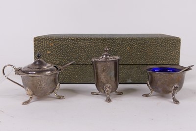 Lot 306 - A George V three-piece silver cruet set,...