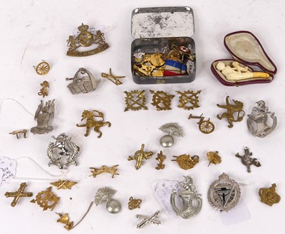 Lot 309 - A collection of military cap badges, to...