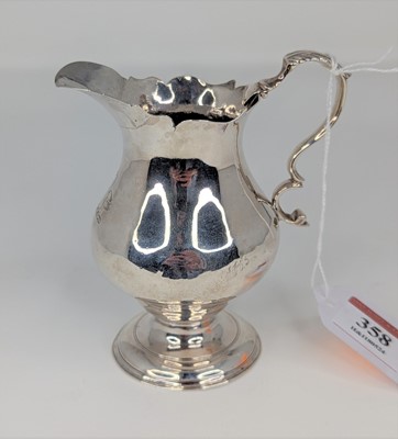 Lot 358 - An 18th century silver cream jug of helmet...