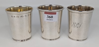 Lot 360 - A set of three modern silver beakers each of...