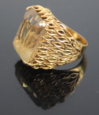 Lot 398 - A modern 18ct gold topaz set dress ring, the...