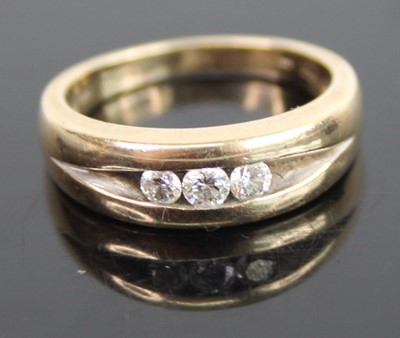 Lot 405 - A modern 9ct gold diamond trilogy ring, the...