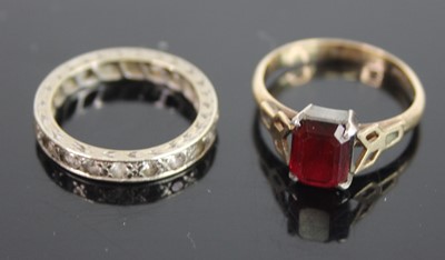 Lot 408 - A 9ct gold and silver set garnet dress ring,...