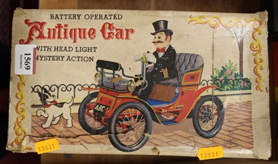 Lot 1569 - A tinplate battery operated antique car, with...