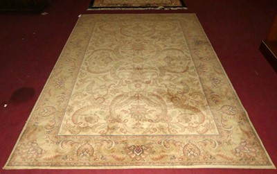 Lot 1115 - A Persian style machine made cream ground...