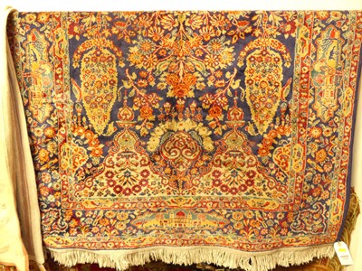 Lot 1180 - A Persian woollen blue ground Tabriz rug, 162...