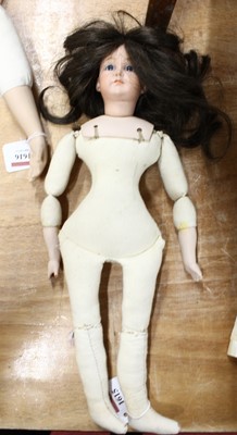 Lot 1615 - A bisque headed and soft filled vintage doll...