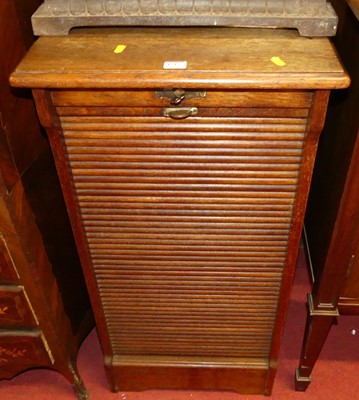 Lot 1215 - A 1920s oak tambour fronted office filing...