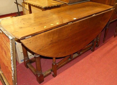 Lot 1228 - A contemporary joined oak dropleaf wake table,...