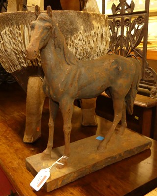 Lot 1237 - A contemporary cast iron model of an equine...