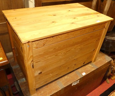 Lot 1239 - A modern planked pine hinge topped toy chest,...