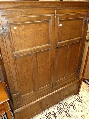 Lot 1268 - An antique joined oak double door panelled...