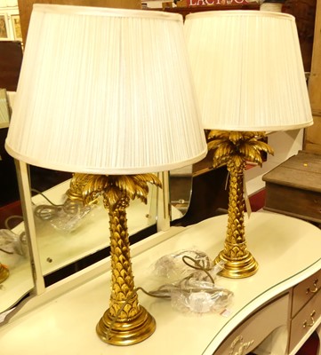 Lot 1271 - A pair of contemporary gilt table lamps, each...