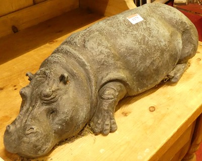 Lot 1275 - A composite model of a recumbent hippopotamus,...